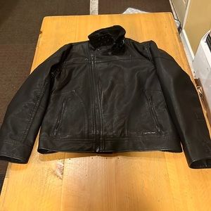NWOT Sherpa lined Calvin Klein jacket. Never been worn. New condition.